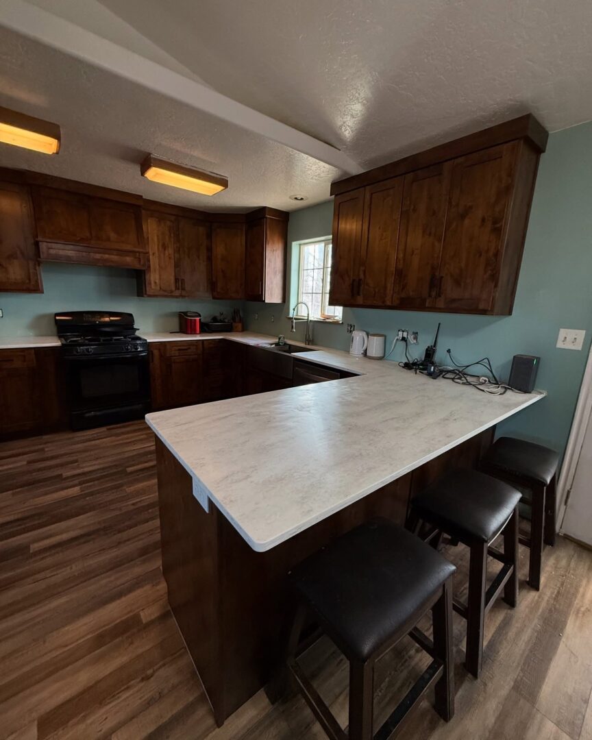 Modern kitchen with wooden cabinets and countertops.