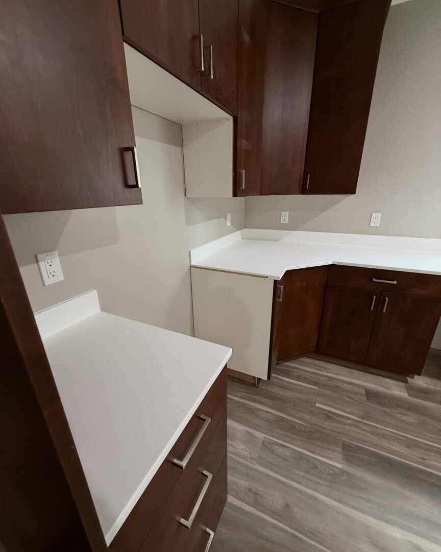 Modern kitchen with dark wood cabinets.