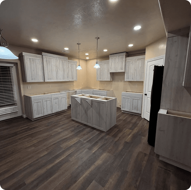 Modern kitchen with wooden cabinets and flooring.