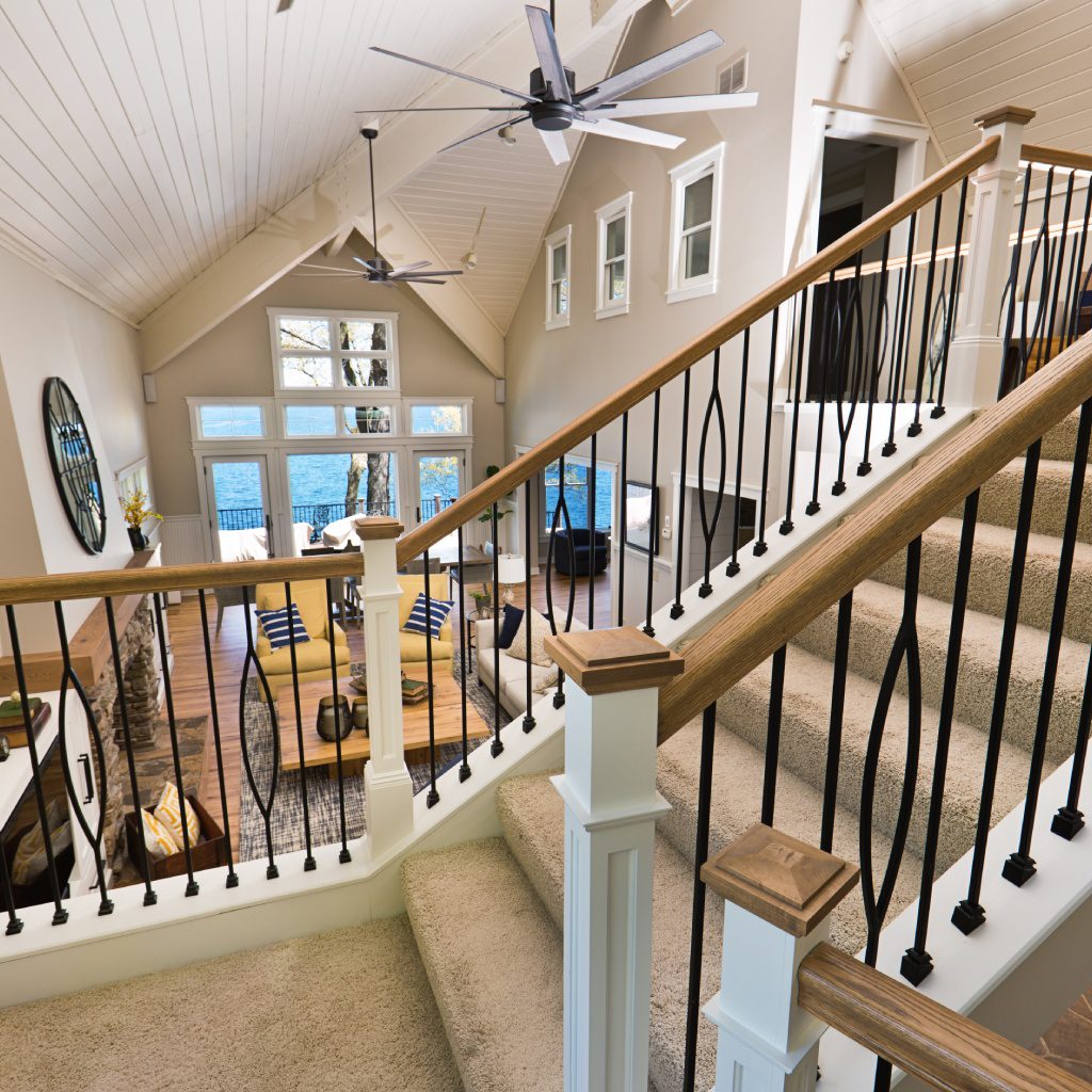 Modern loft-style living room with staircase.